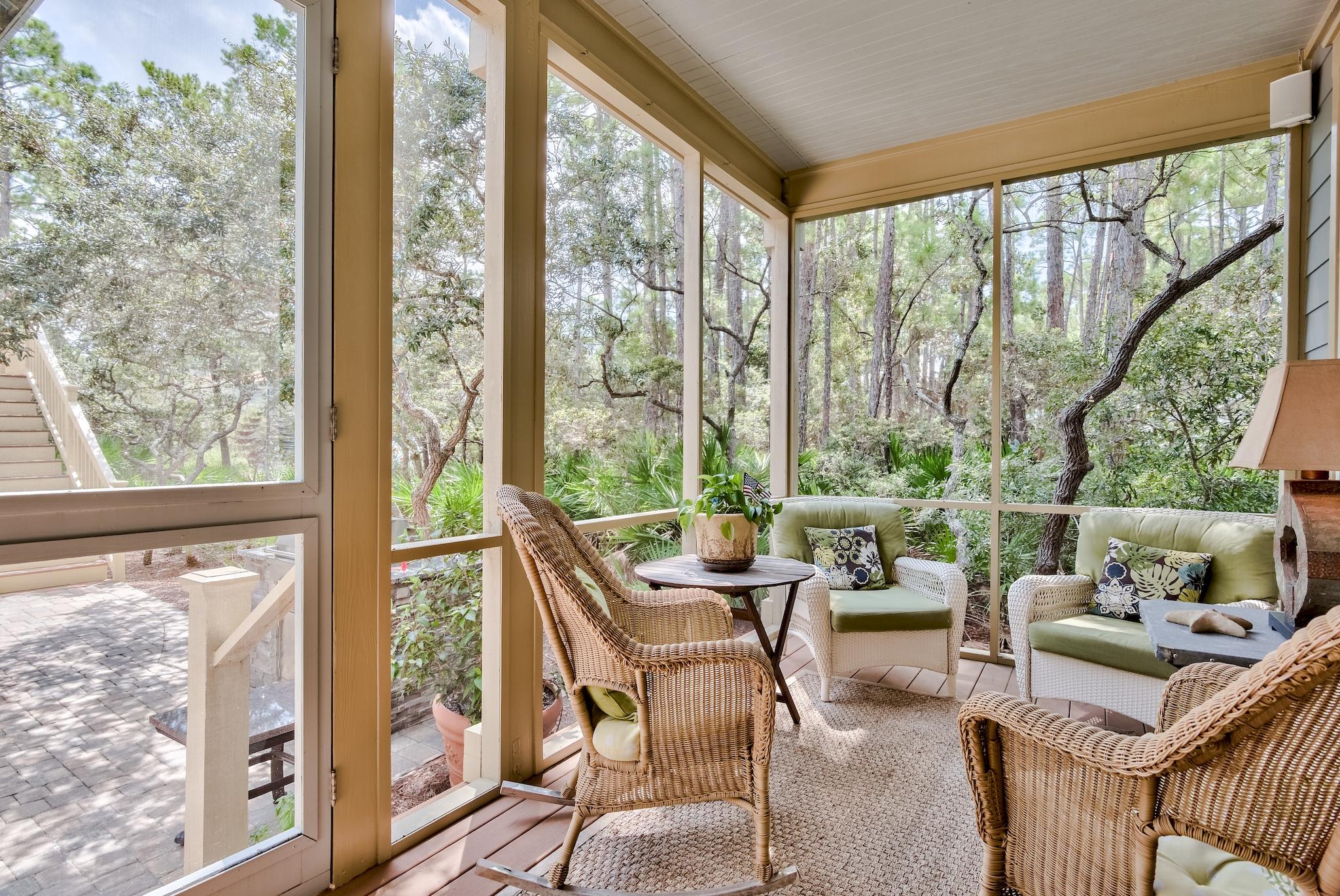 160 North Andalusia Avenue Santa Rosa Beach, FL 32459 - Photo 36 of 61 a living room with large windows and a table
