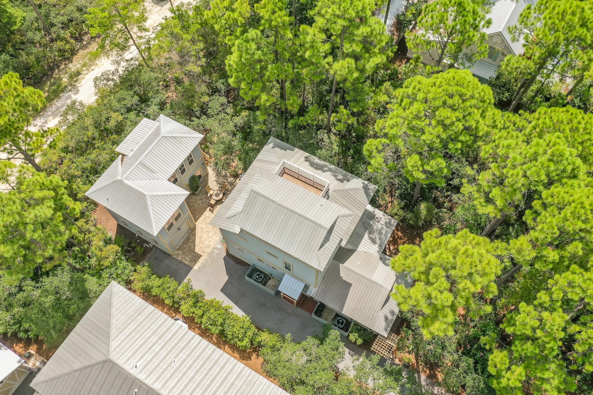 160 North Andalusia Avenue Santa Rosa Beach, FL 32459 - Photo 52 of 61 an aerial view of a house with a yard and trees