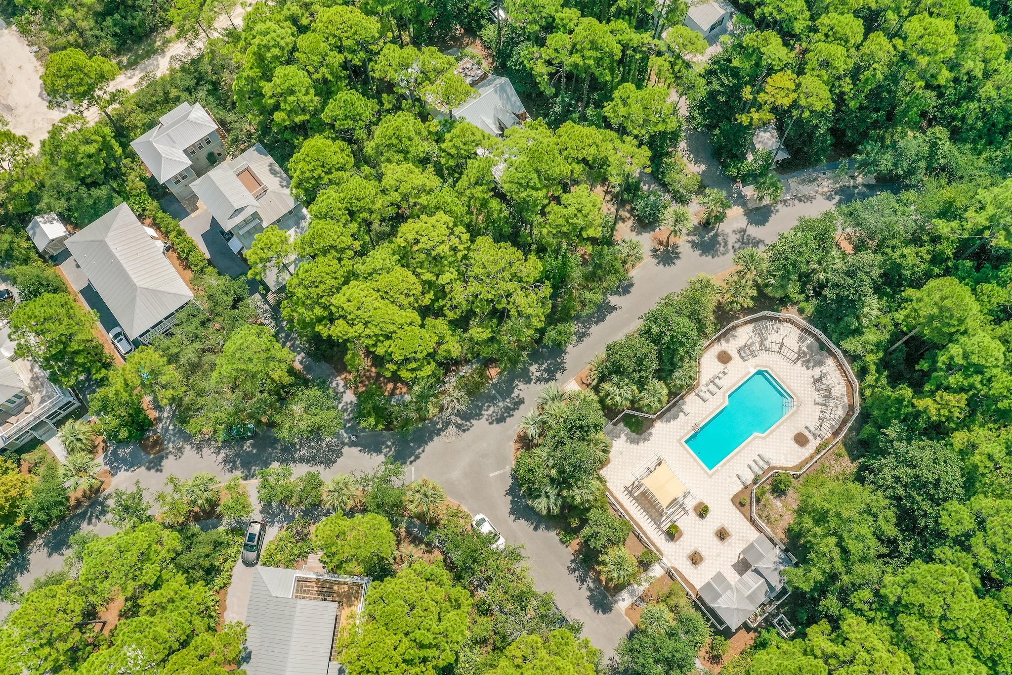160 North Andalusia Avenue Santa Rosa Beach, FL 32459 - Photo 61 of 61 an aerial view of a house with a swimming pool and lake view