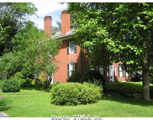73 Chaplin Street Chaplin, CT 06235 - Photo 1 of 1 a front view of a house with garden