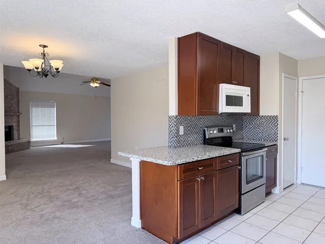 a kitchen with a sink and a stove