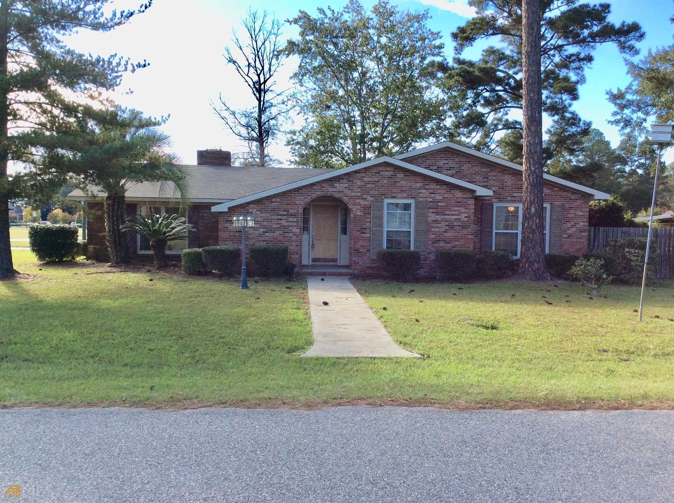 74 Charlton Road Hazlehurst, GA 31539 - Photo 1 of 1 a view of a house with a yard plants and large tree