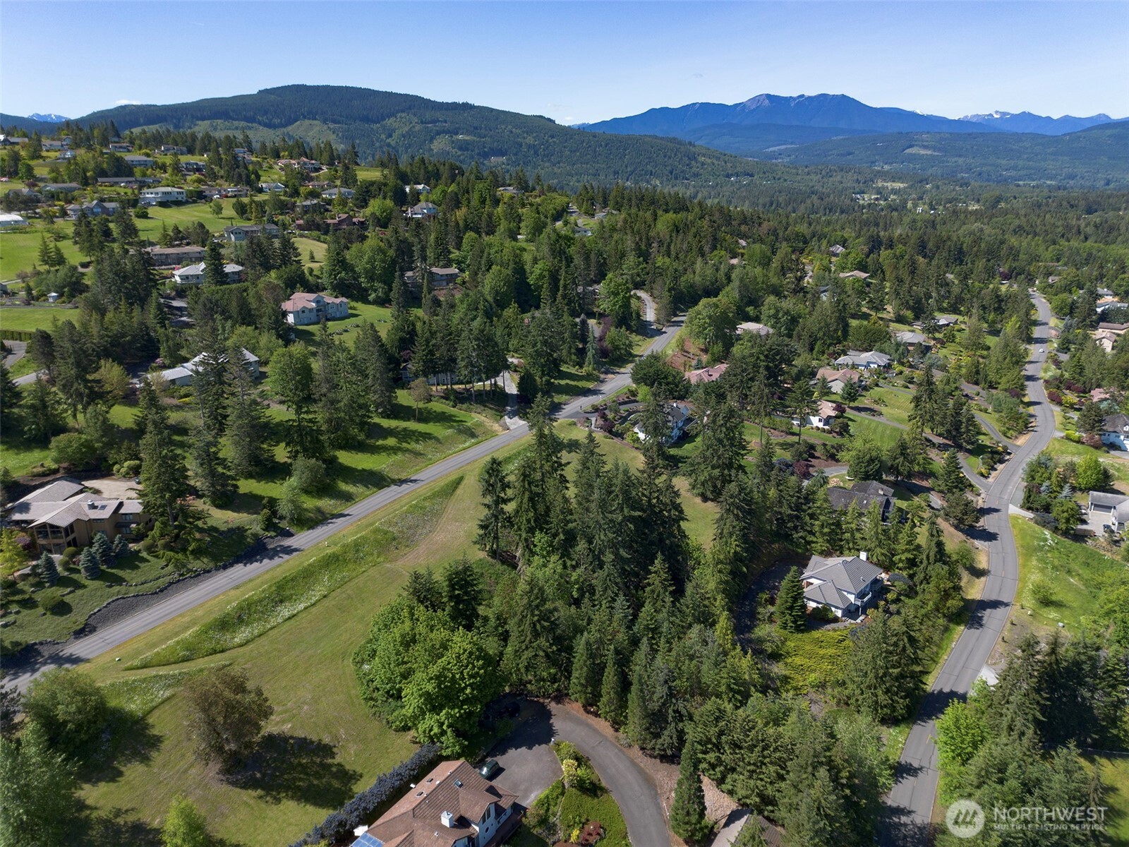 -nka Owls Nest Road Sequim, WA 98382 - Photo 32 of 38 a view of a forest with a street