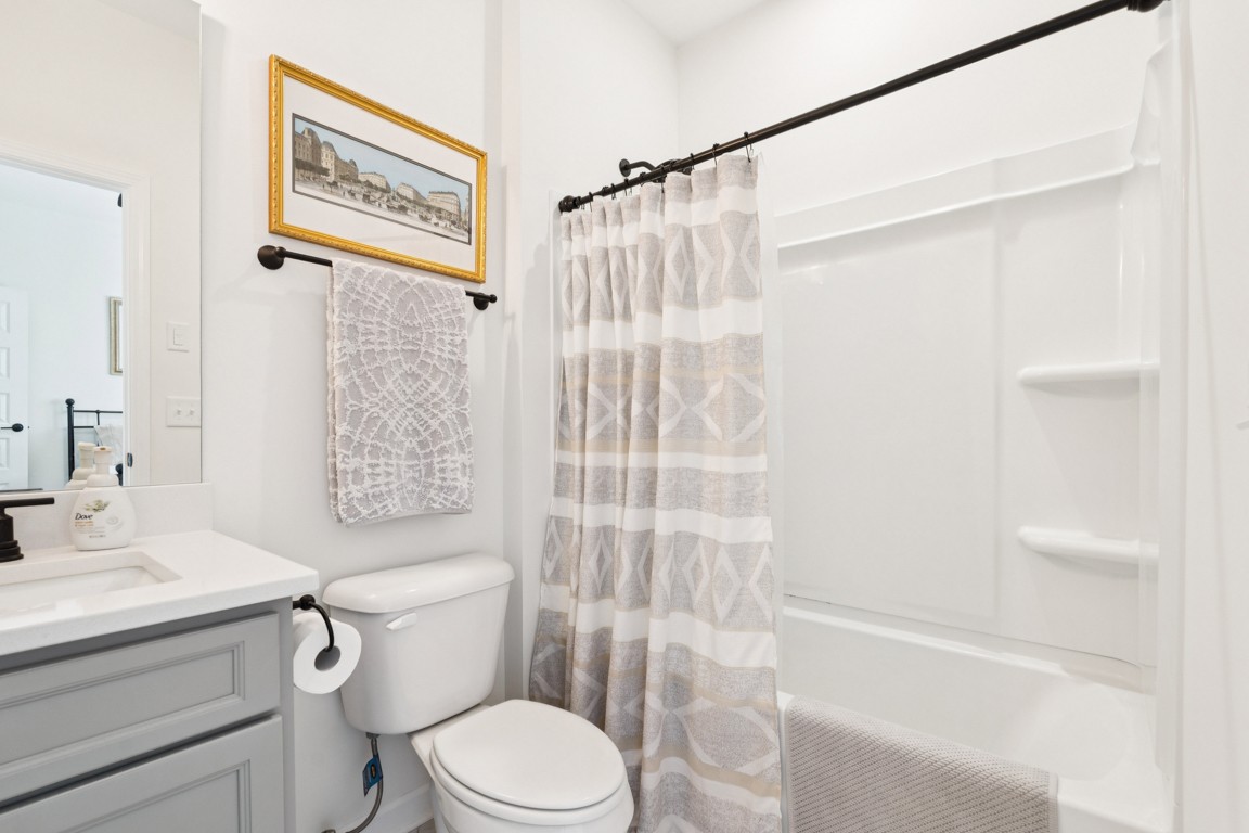 152 Bess Boulevard Spring Hill, TN 37174 - Photo 16 of 25 a bathroom with a sink a toilet and shower