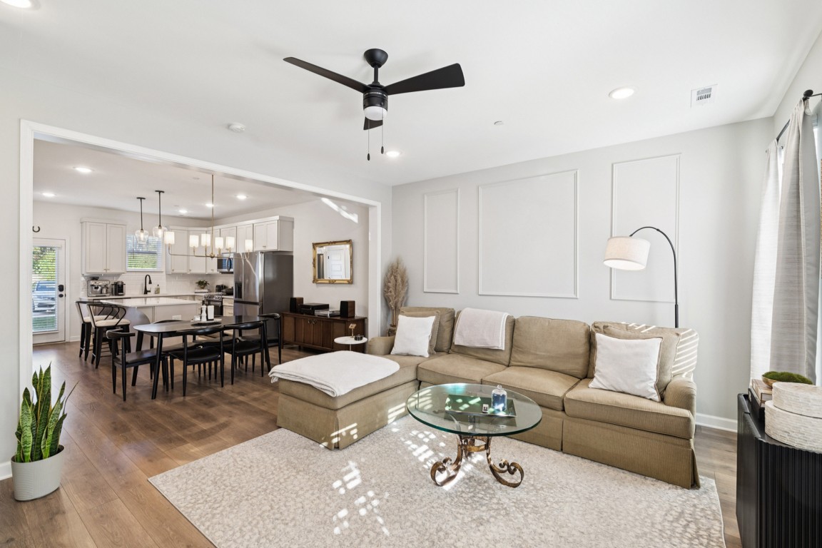 152 Bess Boulevard Spring Hill, TN 37174 - Photo 2 of 25 a living room with furniture kitchen view and a dining table