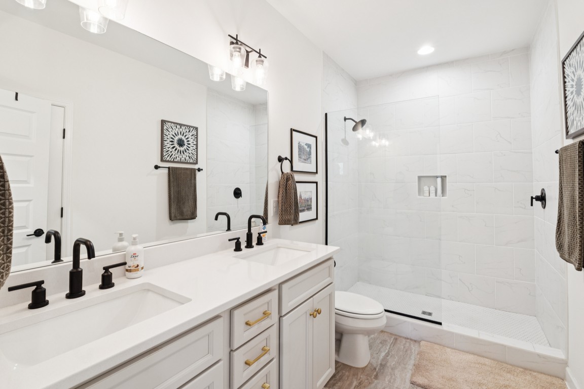 152 Bess Boulevard Spring Hill, TN 37174 - Photo 22 of 25 a bathroom with a double vanity sink toilet and shower