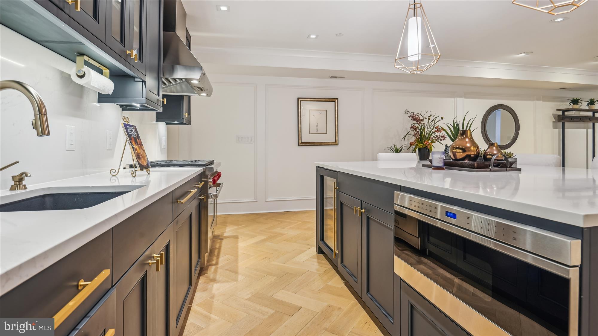 1832 16th Street Northwest, Unit 1 Washington, DC 20009 - Photo 11 of 25 a kitchen with stainless steel appliances a sink stove and cabinets