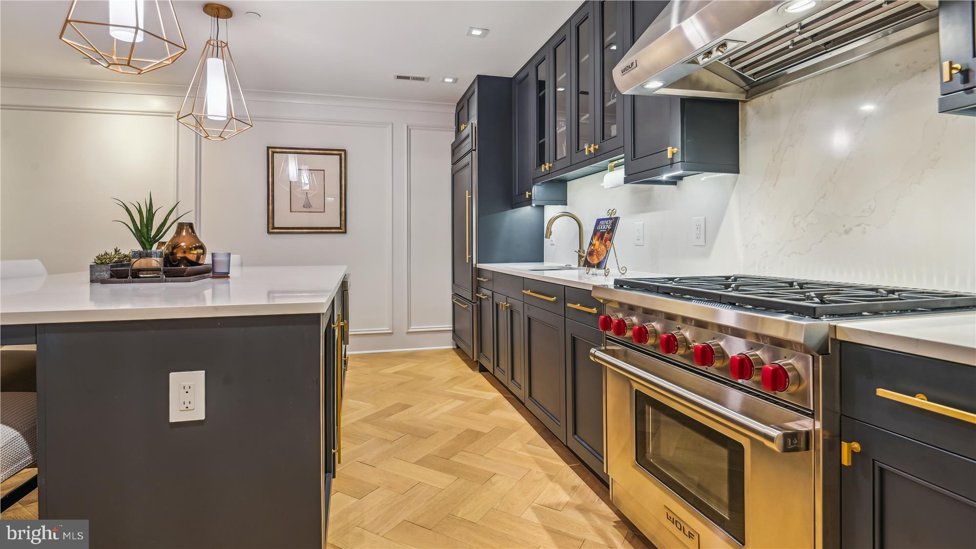 1832 16th Street Northwest, Unit 1 Washington, DC 20009 - Photo 10 of 25 a kitchen with stainless steel appliances granite countertop a stove a sink and a refrigerator