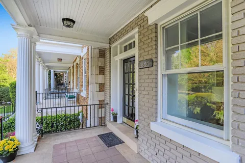 a view of a door of a house with a porch