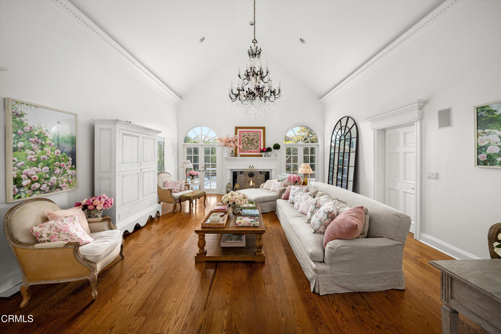 6885 Coyote Canyon Road Somis, CA 93066 - Photo 2 of 35 a living room with furniture and a chandelier
