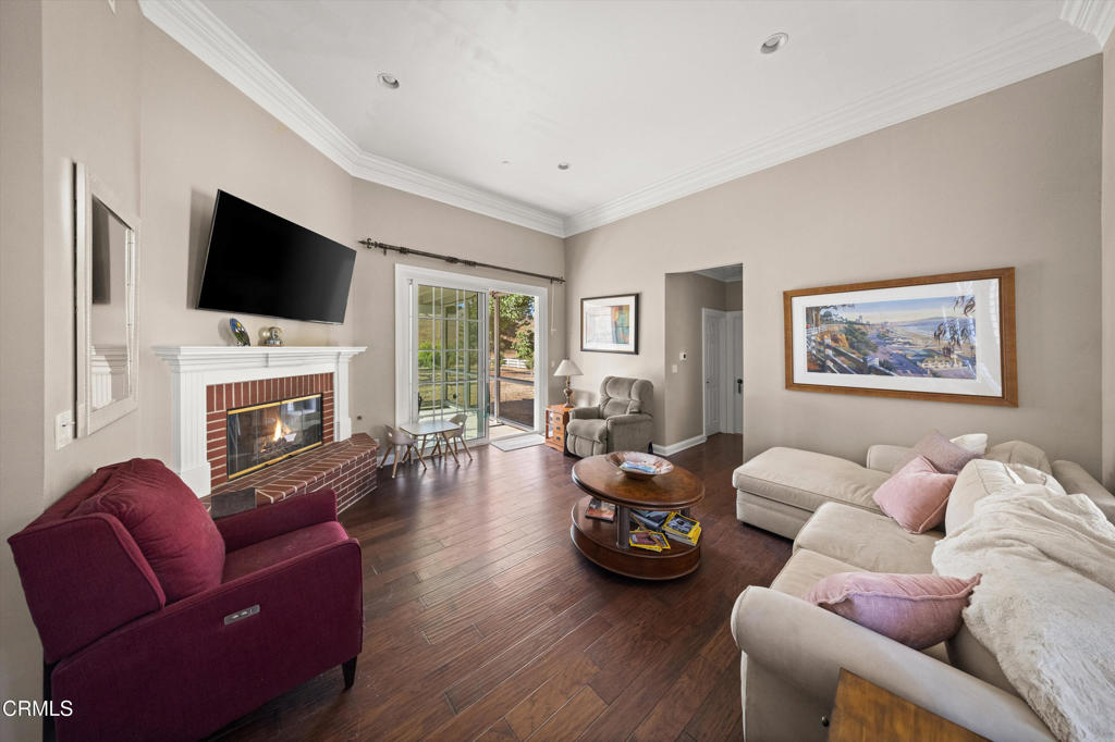 6885 Coyote Canyon Road Somis, CA 93066 - Photo 22 of 35 a living room with furniture floor to ceiling window hardwood floor and a flat screen tv