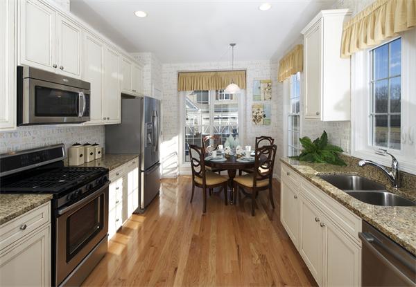 a kitchen with granite countertop lots of counter top space and stainless steel appliances