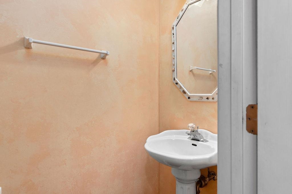 661 Jefferson Drive Palmyra, VA 22963 - Photo 14 of 41 a bathroom with a sink a mirror and shower