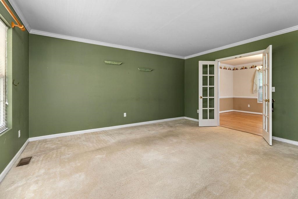 661 Jefferson Drive Palmyra, VA 22963 - Photo 28 of 41 a view of an empty room with wooden floor and a window