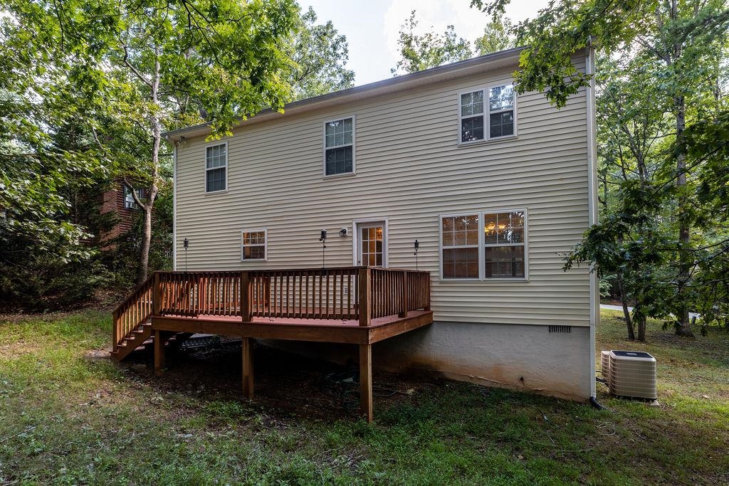 661 Jefferson Drive Palmyra, VA 22963 - Photo 6 of 41 a view of a house with a yard and a wooden deck