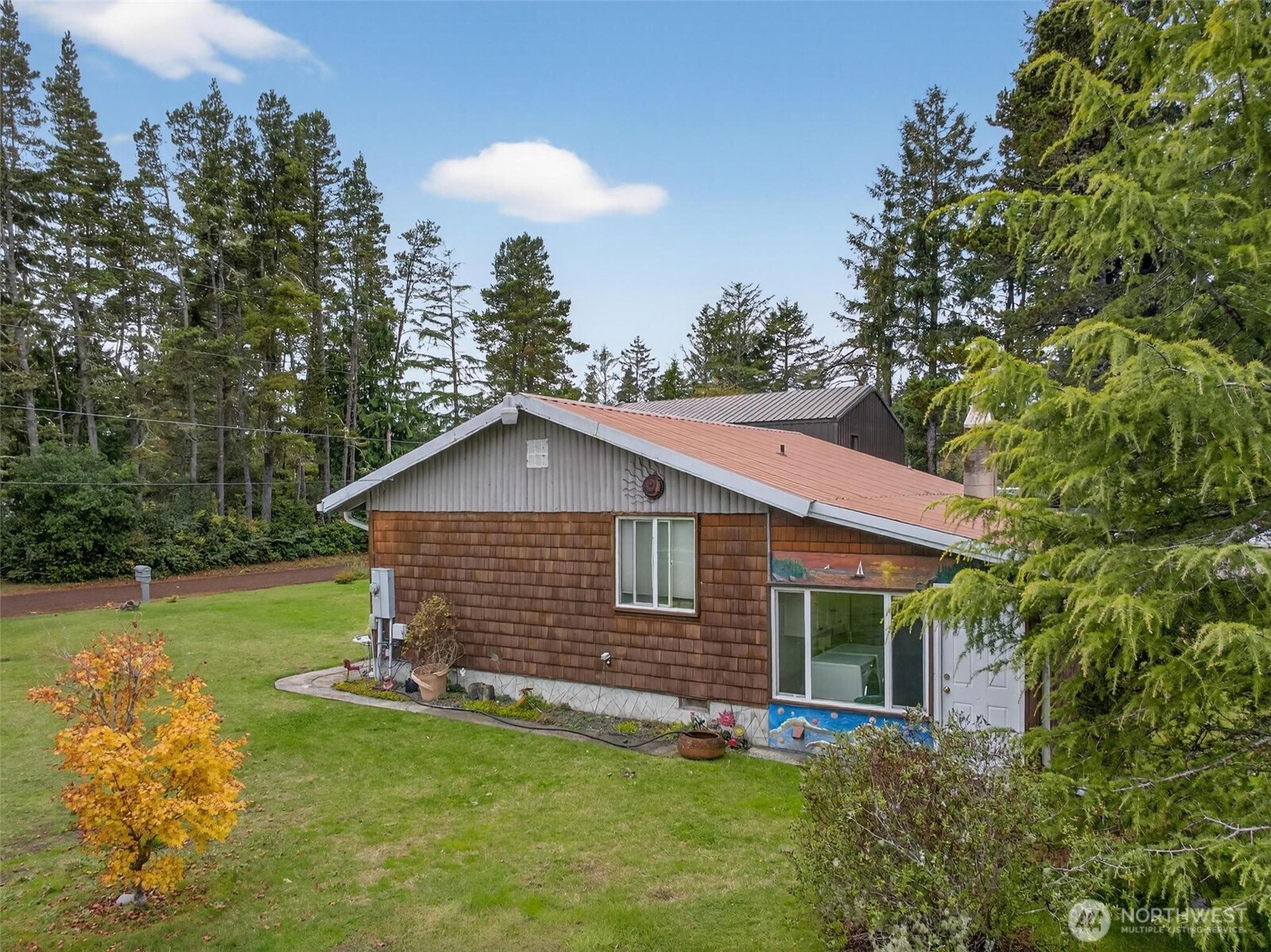 27501 R Lane Ocean Park, WA 98640 - Photo 11 of 40 a view of a house with a yard and sitting area