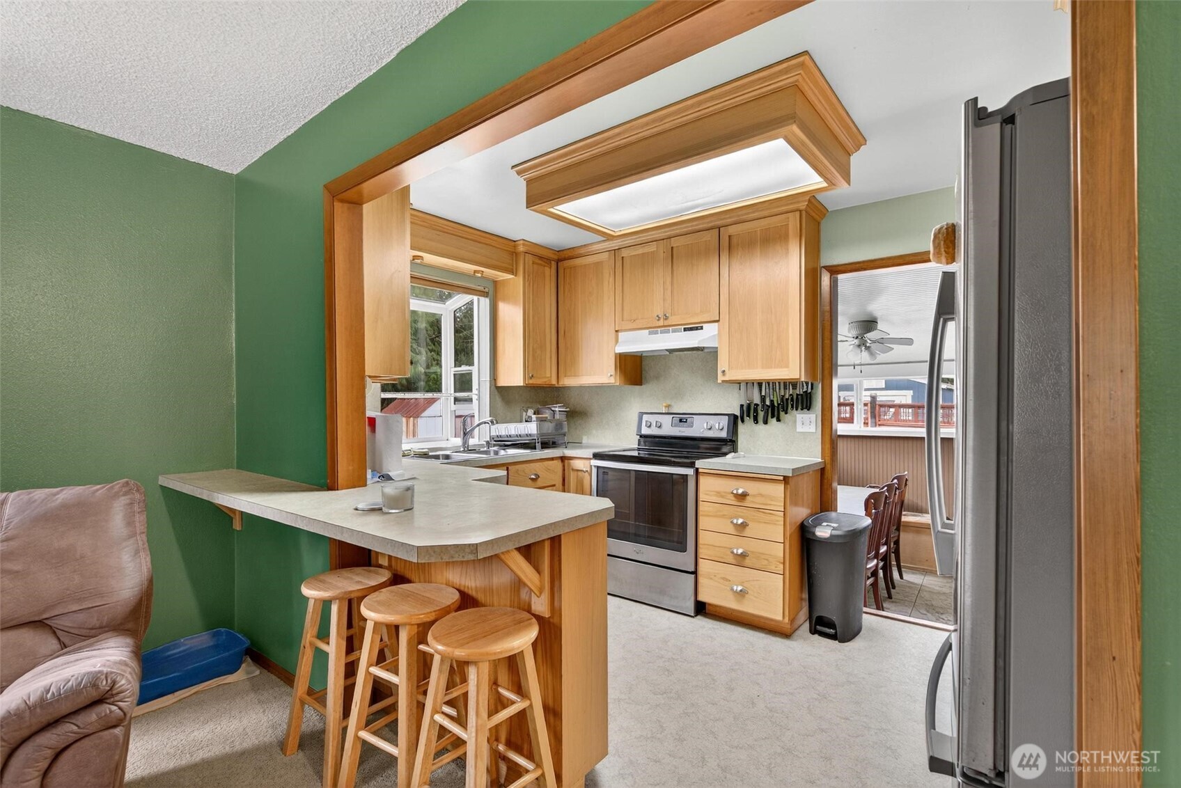 27501 R Lane Ocean Park, WA 98640 - Photo 18 of 40 a view of a dining room with furniture and a window
