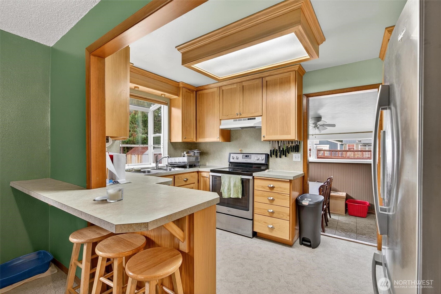 27501 R Lane Ocean Park, WA 98640 - Photo 19 of 40 a kitchen with a stove a sink and a refrigerator