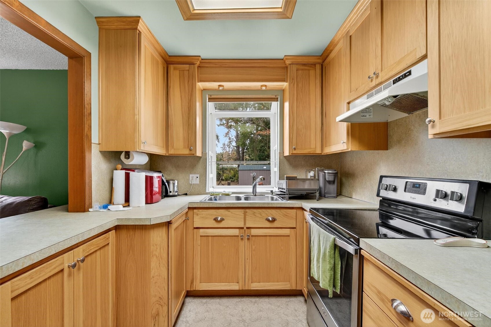 27501 R Lane Ocean Park, WA 98640 - Photo 20 of 40 a kitchen with stainless steel appliances granite countertop a sink and a stove