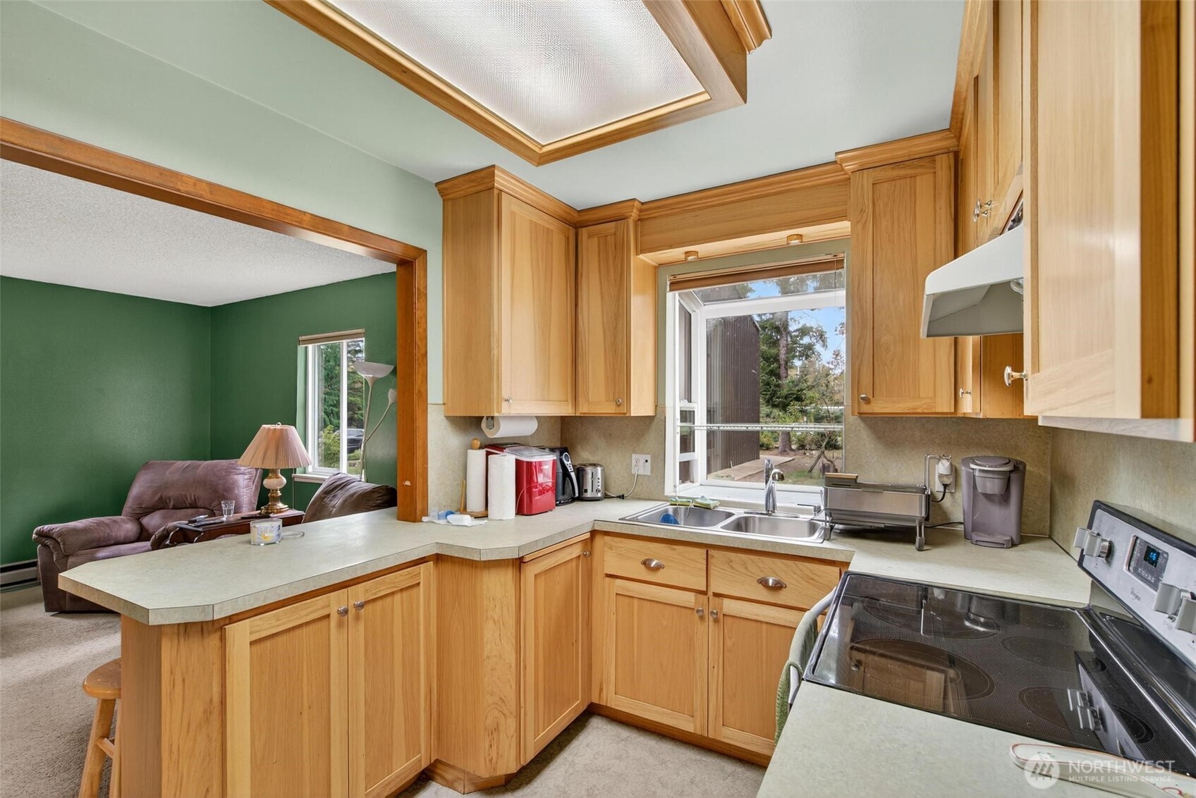 27501 R Lane Ocean Park, WA 98640 - Photo 21 of 40 a kitchen with stainless steel appliances granite countertop a sink stove and cabinets