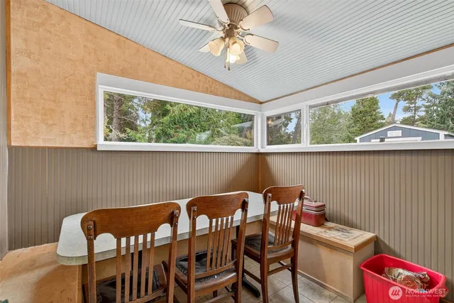 a view of a dining room with furniture window and outside view