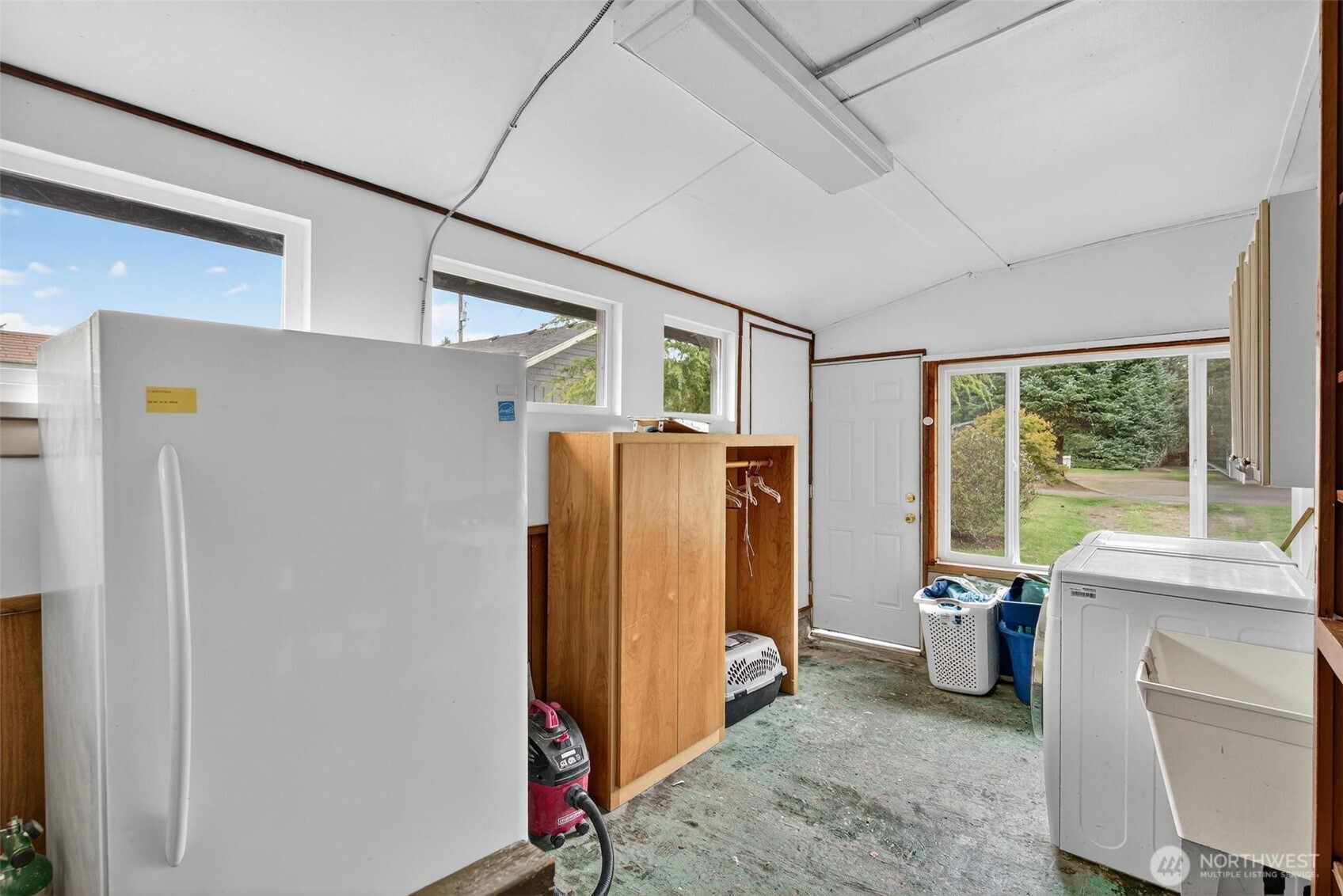27501 R Lane Ocean Park, WA 98640 - Photo 26 of 40 a view of a refrigerator in kitchen and a window