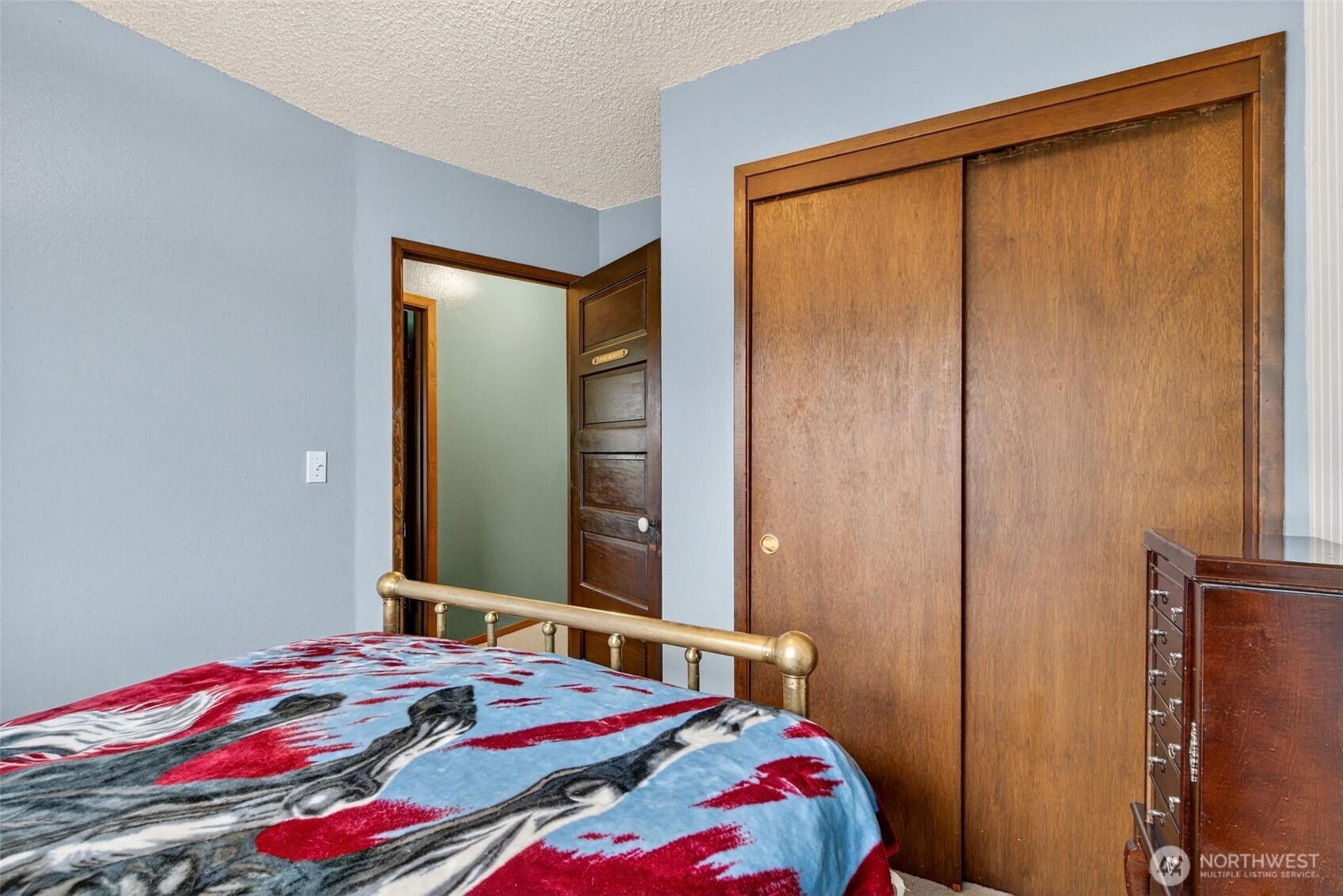 27501 R Lane Ocean Park, WA 98640 - Photo 32 of 40 a bedroom with a bed and a mirror