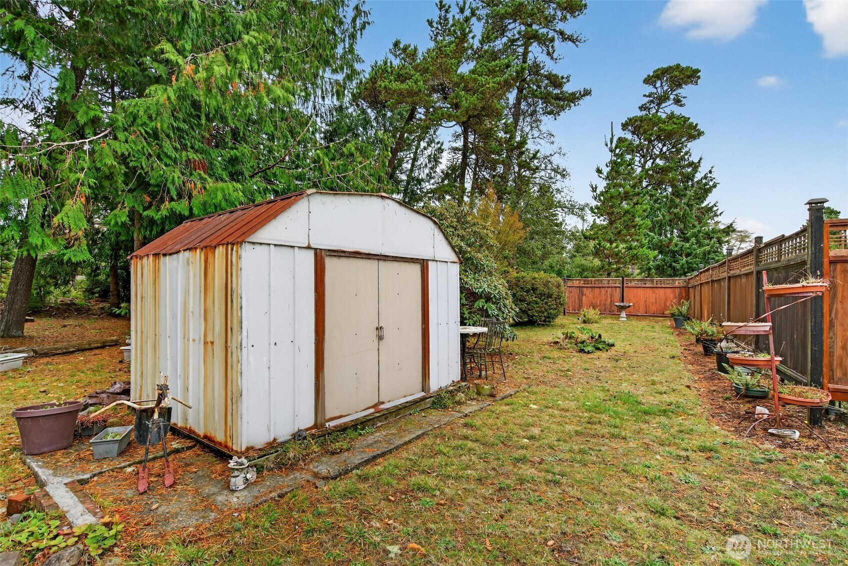27501 R Lane Ocean Park, WA 98640 - Photo 37 of 40 a backyard of a house with barbeque oven and outdoor seating