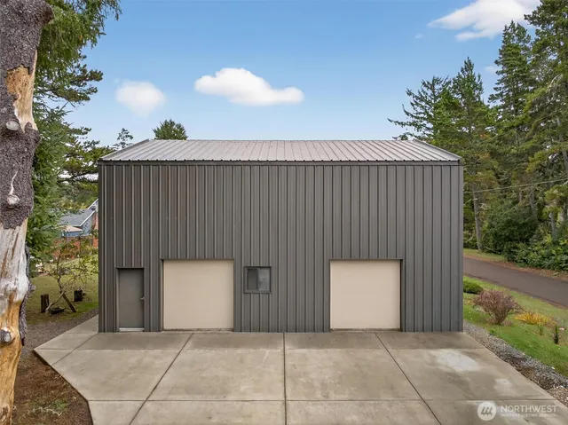 an outdoor space with sliding door and mountain view