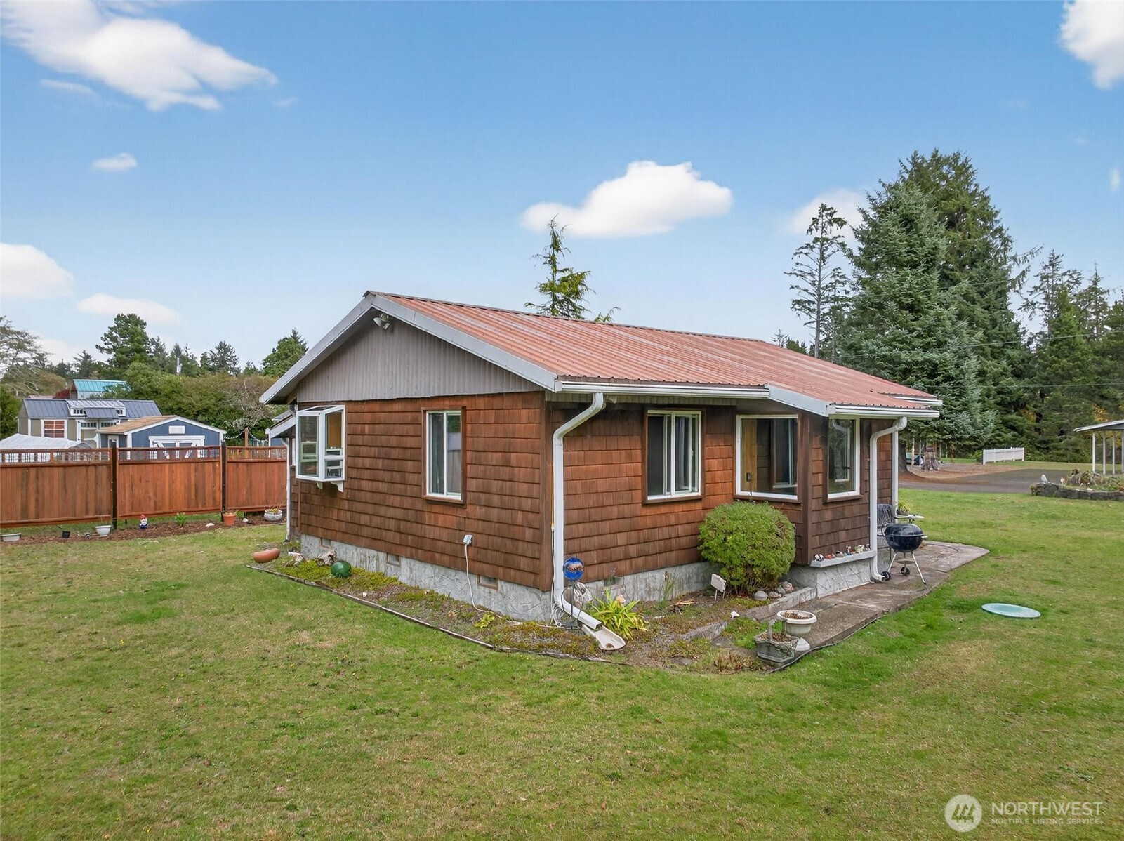 27501 R Lane Ocean Park, WA 98640 - Photo 7 of 40 a front view of a house with a yard
