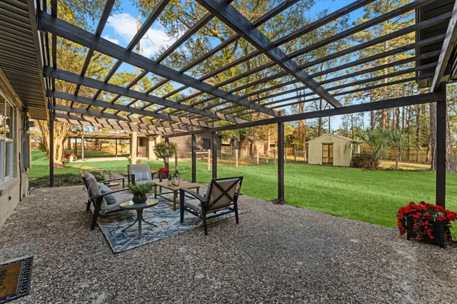 a view of a house with a yard and porch