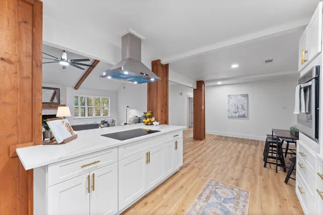 a kitchen with stainless steel appliances a refrigerator sink and cabinets