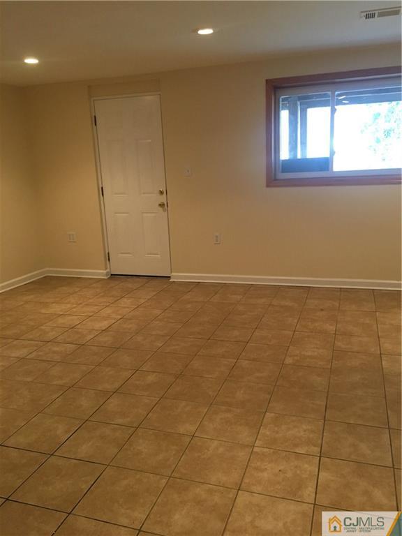 100 Dover Road Colonia, NJ 07067 - Photo 13 of 25 a view of an empty room with a window