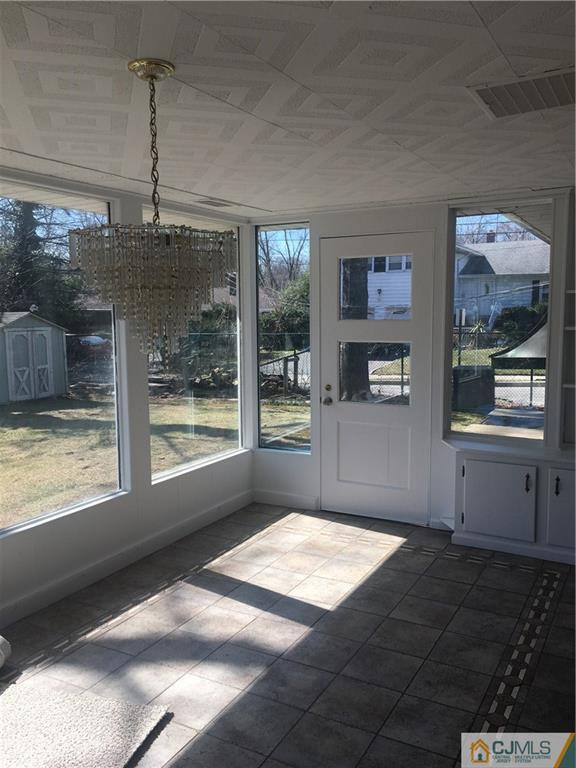 100 Dover Road Colonia, NJ 07067 - Photo 7 of 25 a bedroom with a bed and a window