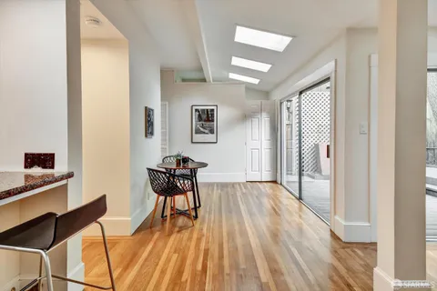 a view of a room with furniture window and wooden floor