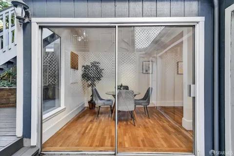 a view of a balcony with chairs