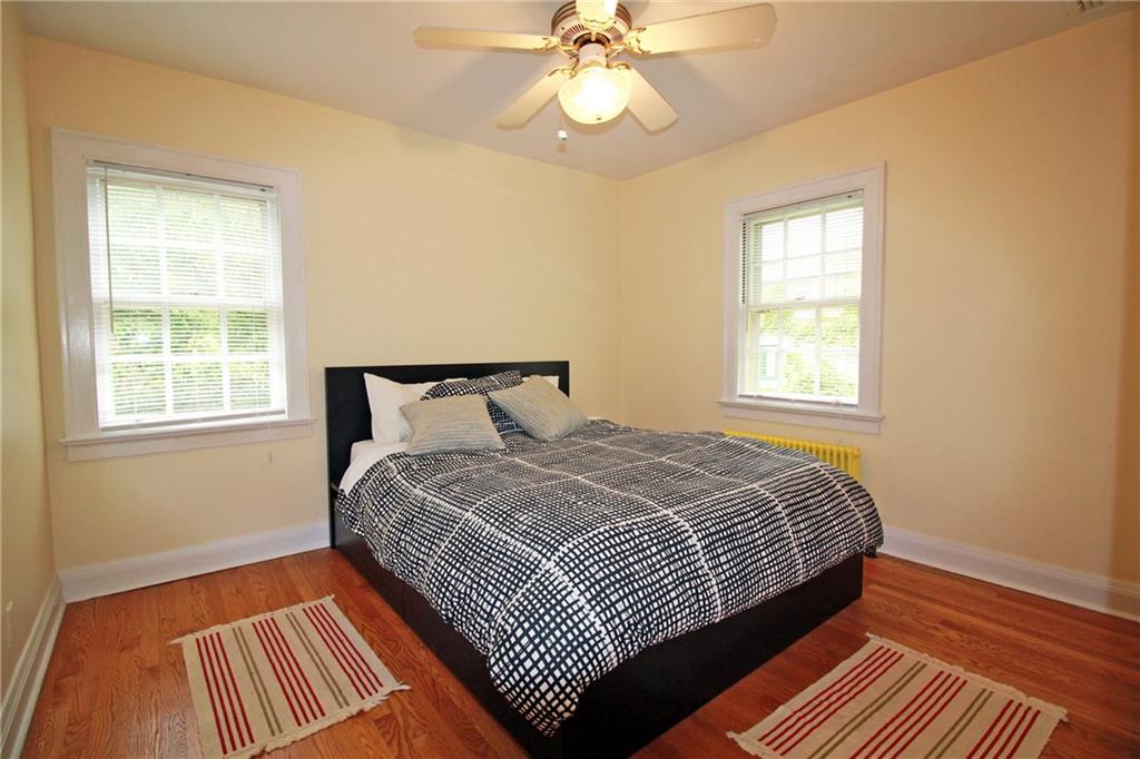 406 Olympia Road Pittsburgh, PA 15211 - Photo 11 of 13 The second bedroom is also generously sized and has a large closet as well.