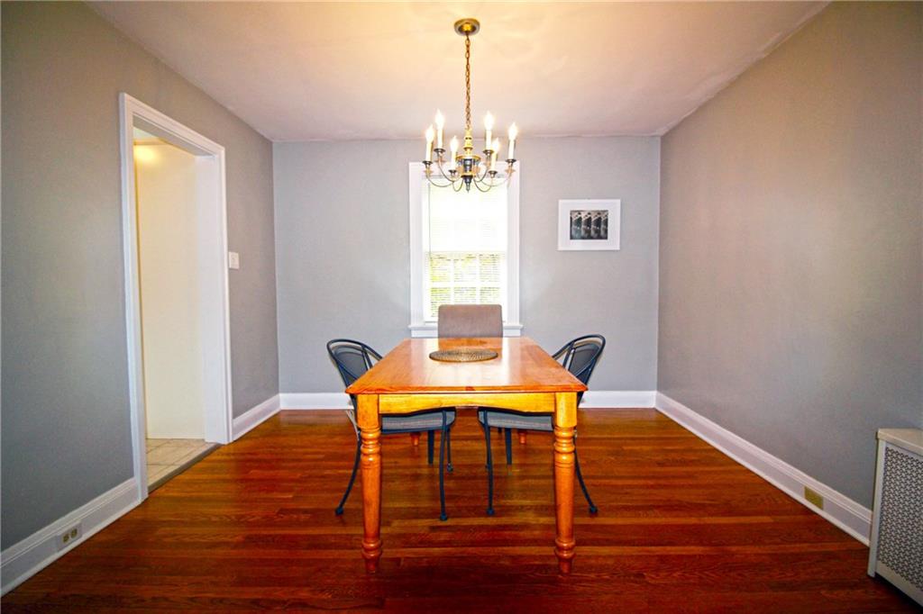 406 Olympia Road Pittsburgh, PA 15211 - Photo 6 of 13 The dining room flows from the kitchen and living room. Entertaining is a joy in this lovely town home.
