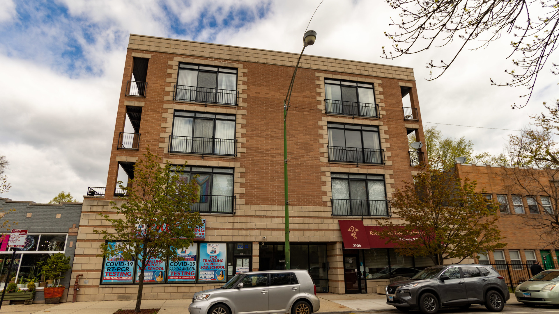 a front view of a building and a street