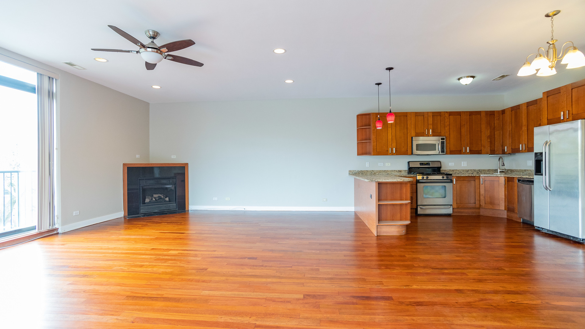 Undisclosed Address Chicago, IL 60645 - Photo 5 of 18 a view of kitchen with stainless steel appliances refrigerator stove microwave and cabinets