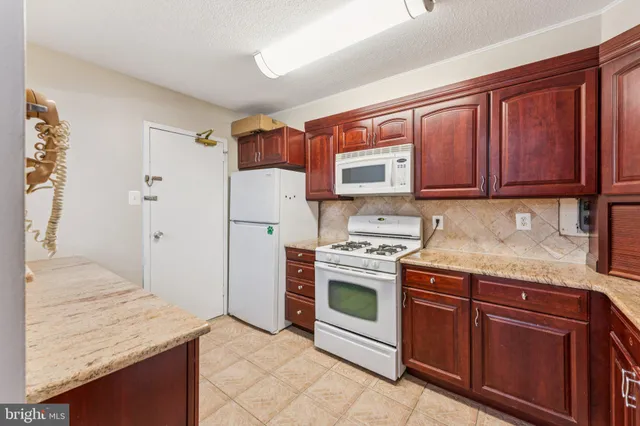 a view of a hallway to rooms