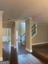 a view of entryway with stairs and wooden floor