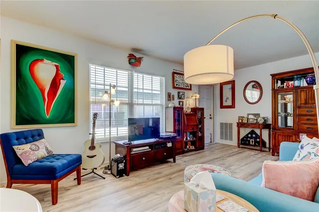 a front view of a house with entryway and wooden floor