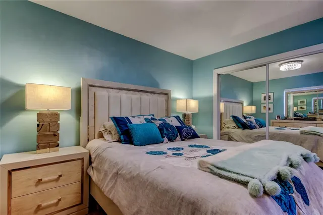 a bedroom with a bed and a dresser