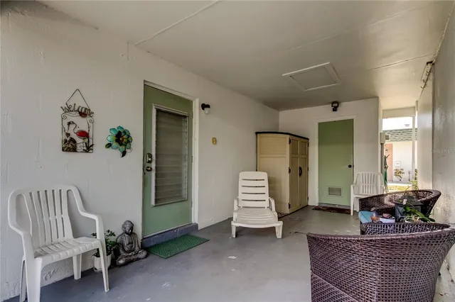 a living room with furniture and a chair