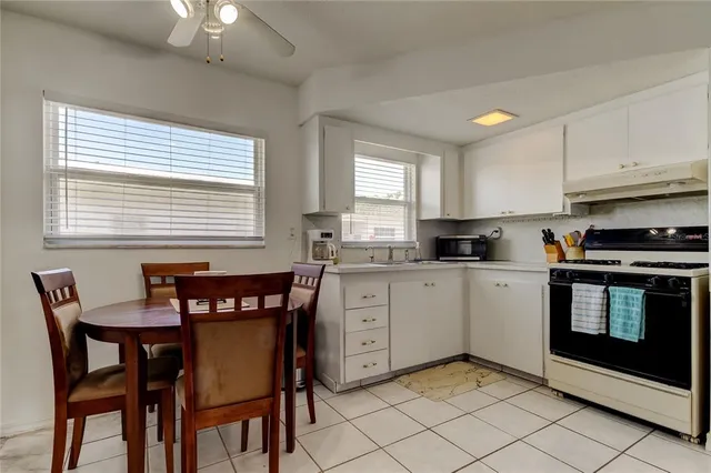 a kitchen with a stove and a sink