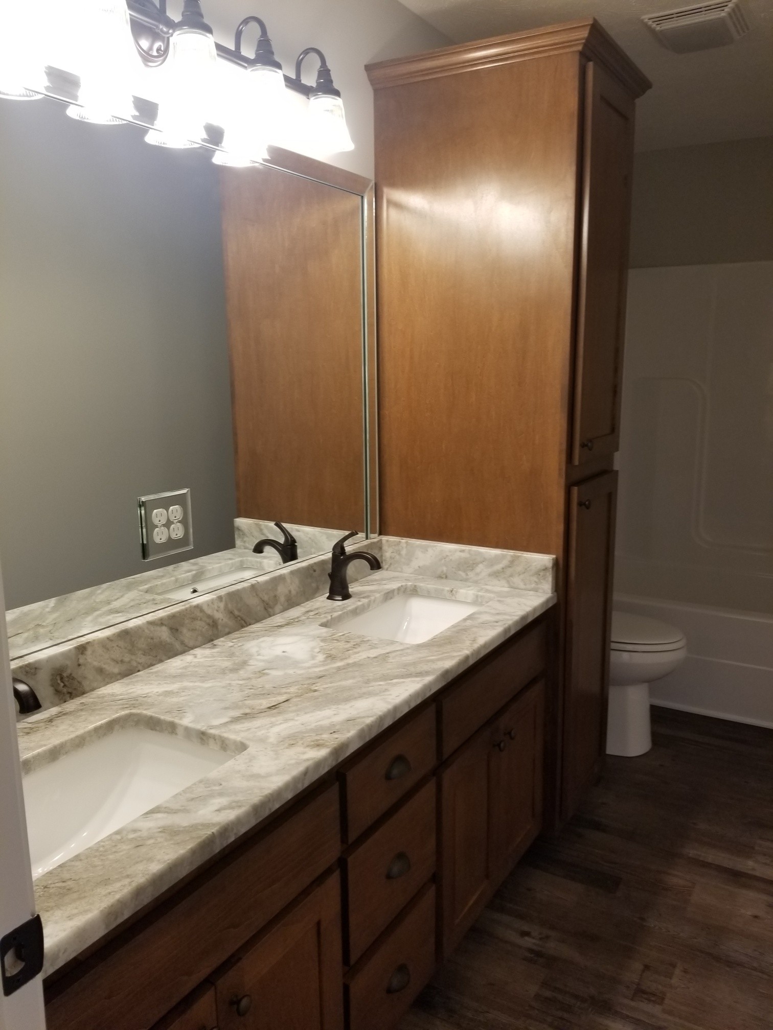 2145 Austin Road Lafayette, TN 37083 - Photo 12 of 21 a bathroom with a granite countertop sink and a mirror