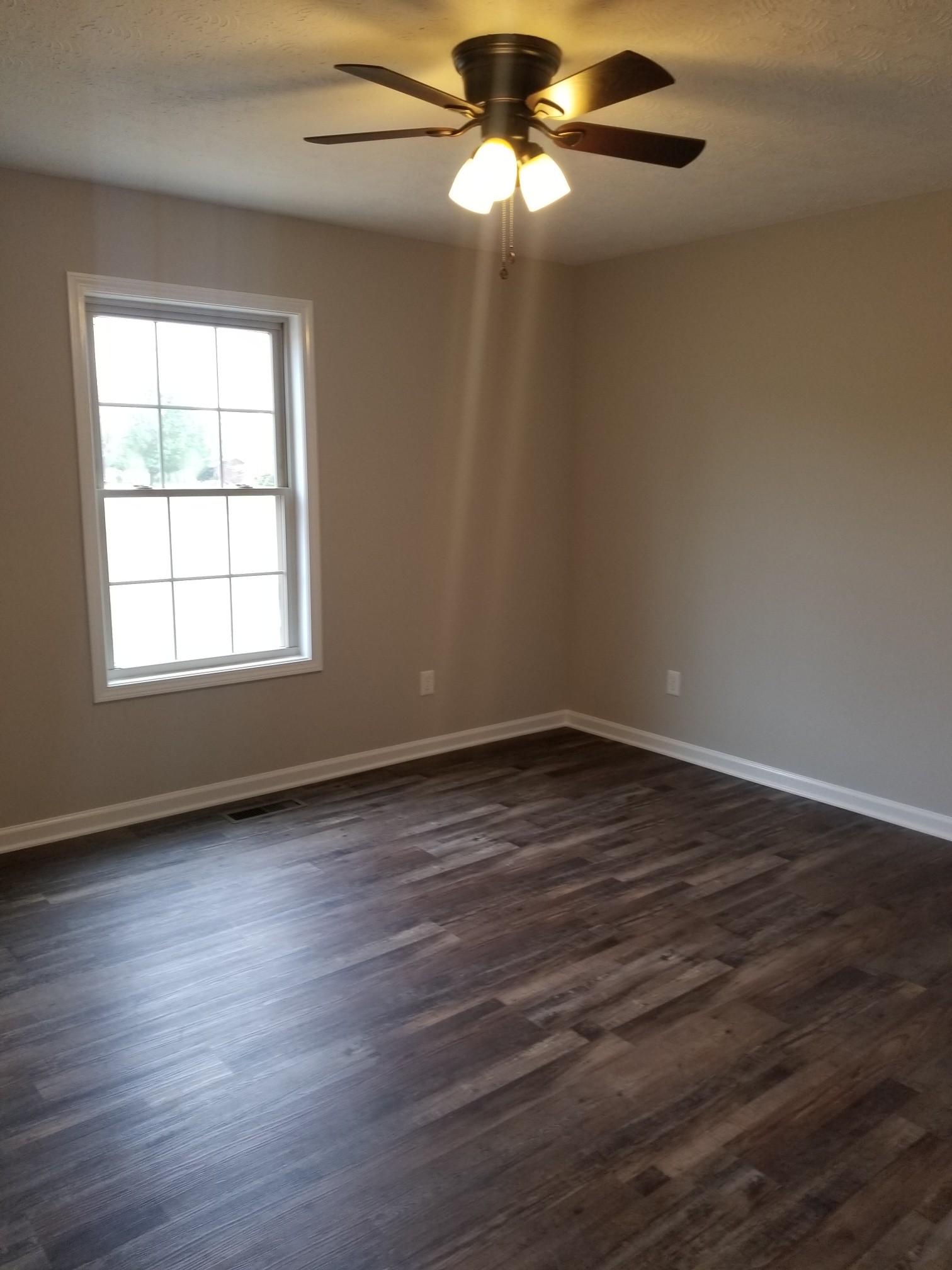 2145 Austin Road Lafayette, TN 37083 - Photo 17 of 21 an empty room with wooden floor closet and windows