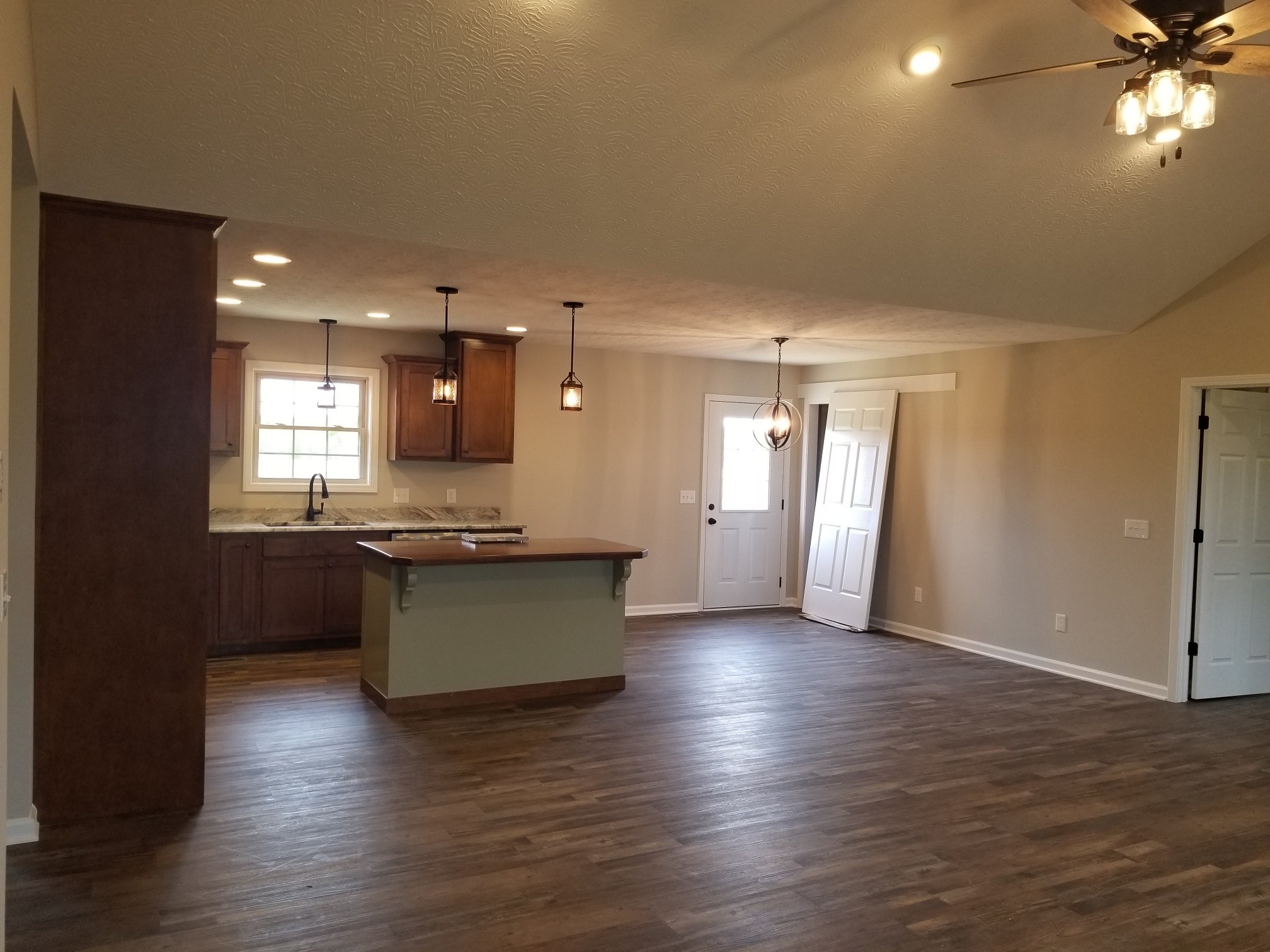 2145 Austin Road Lafayette, TN 37083 - Photo 3 of 21 a view of kitchen and hall with wooden floor