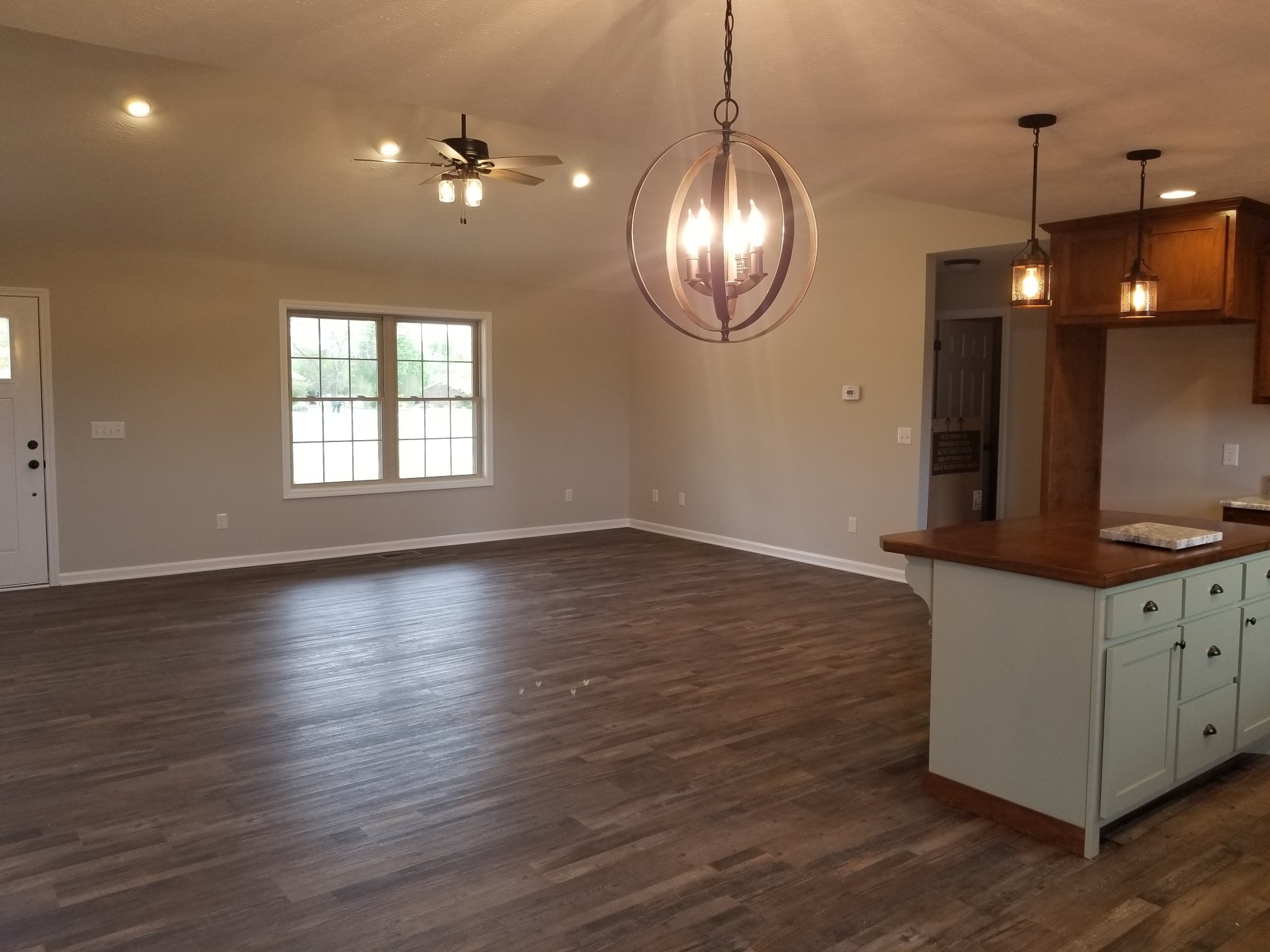 2145 Austin Road Lafayette, TN 37083 - Photo 7 of 21 wooden floor in an empty room with a window